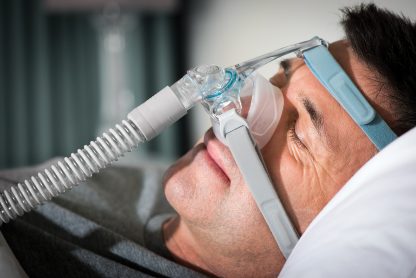 Closeup of Man Sleeping with CPAP Mask