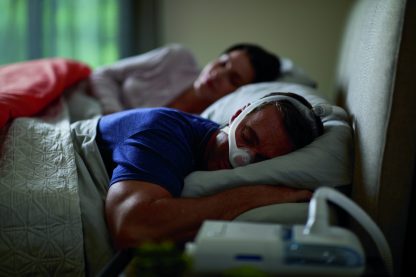 Man Sleeping with CPAP Mask - cpapRX