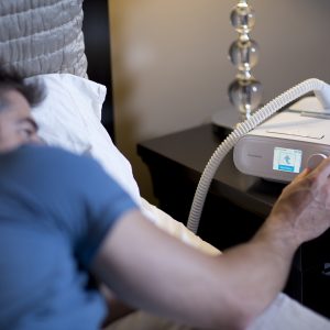 Man Using CPAP Machine - cpapRX