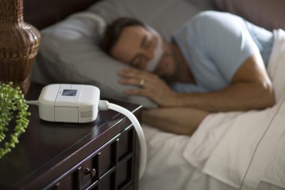CPAP Machine on Nightstand - cpapRX